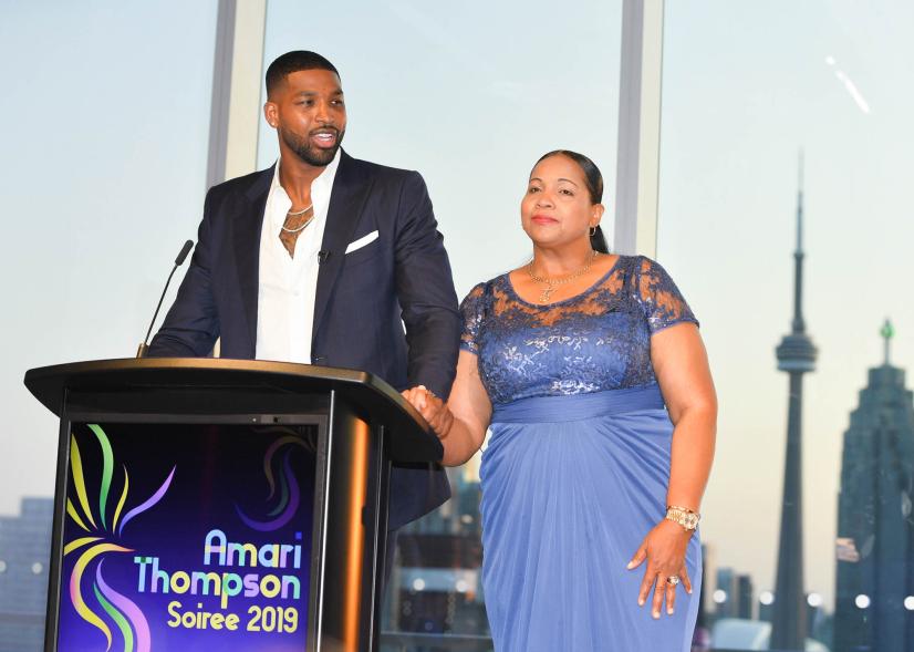 Andrea Thompson and Tristan Thompson onstage at an event.