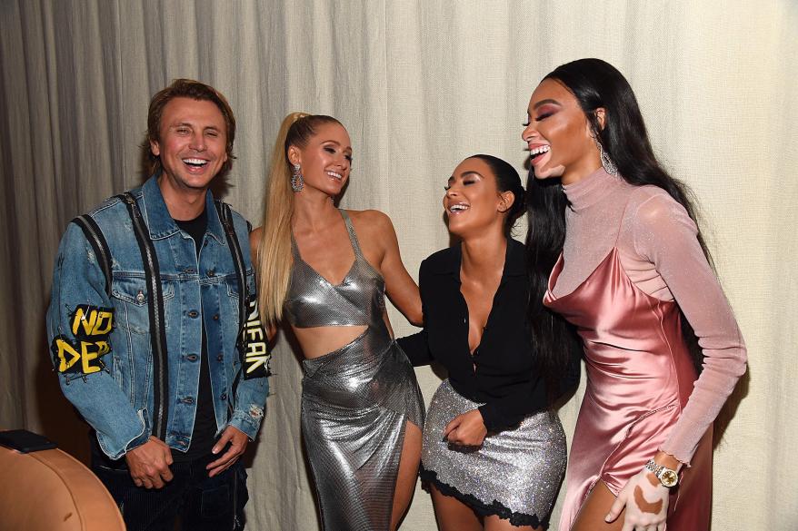 Jonathan Cheban, Paris Hilton, Winnie Harlow, Kim Kardashian and Winnie Harlow laughing while taking a photo together.