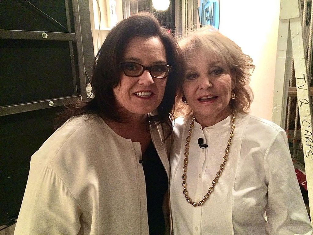 Rosie O'Donnell and Barbara Walters posing for a photo together.