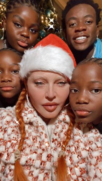 Madonna takes selfie in Santa Claus hat with David, Mercy, Stella and Estere