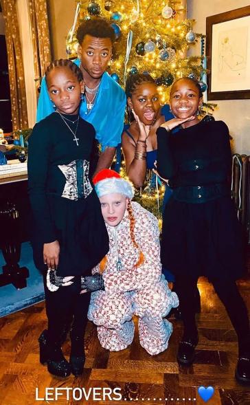 Madonna poses in front of Christmas tree with David, Mercy, Stella and Estere