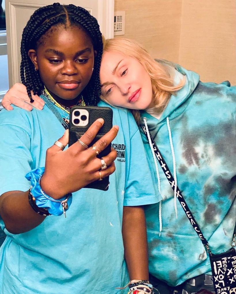 Madonna leans on daughter Mercy for mirror selfie in blue