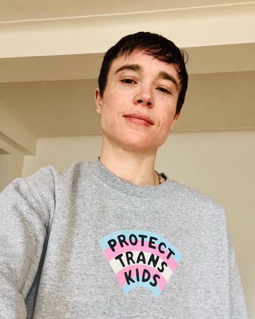 Elliot Page wearing a "Protect Trans Kids" shirt.