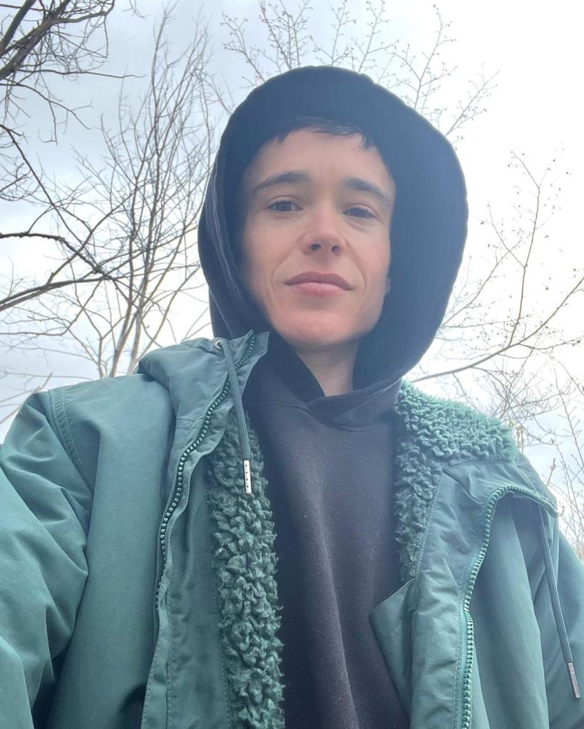 A selfie of Elliot Page wearing a hoodie.