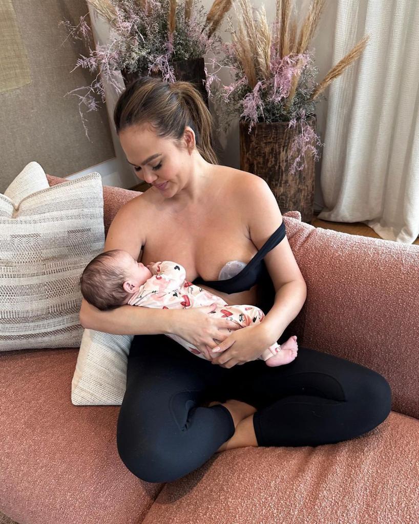 Chrissy Teigen nursing Esti.