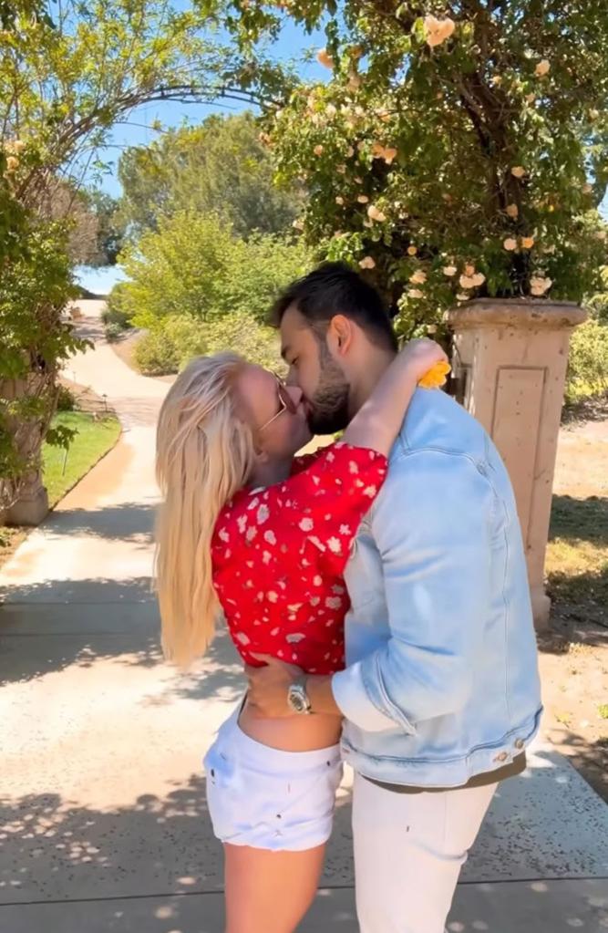 Sam Asghari kissing Britney Spears.