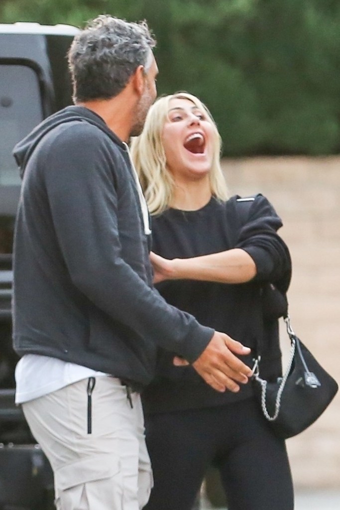 Mauricio Umansky and Emma Slater holding hands. 