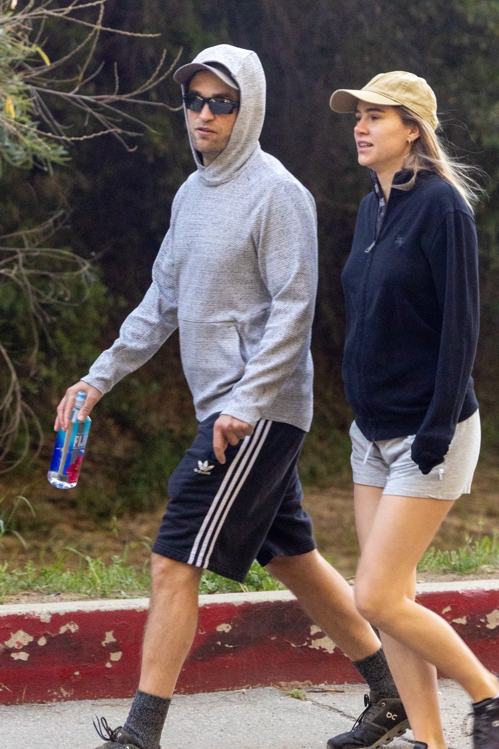 Robert Pattinson and Suki Waterhouse going for a hike.