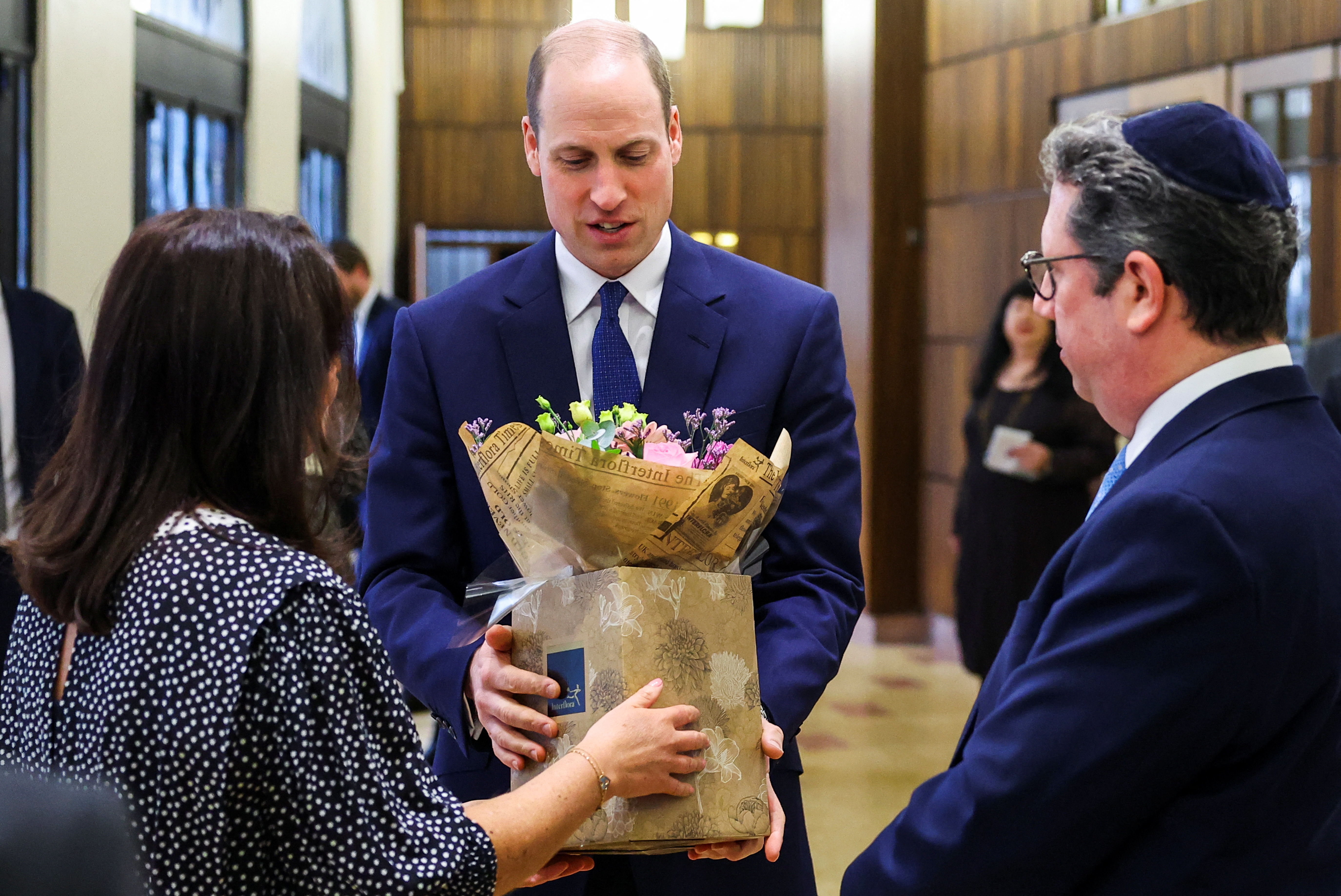 Prince William accepting flowers