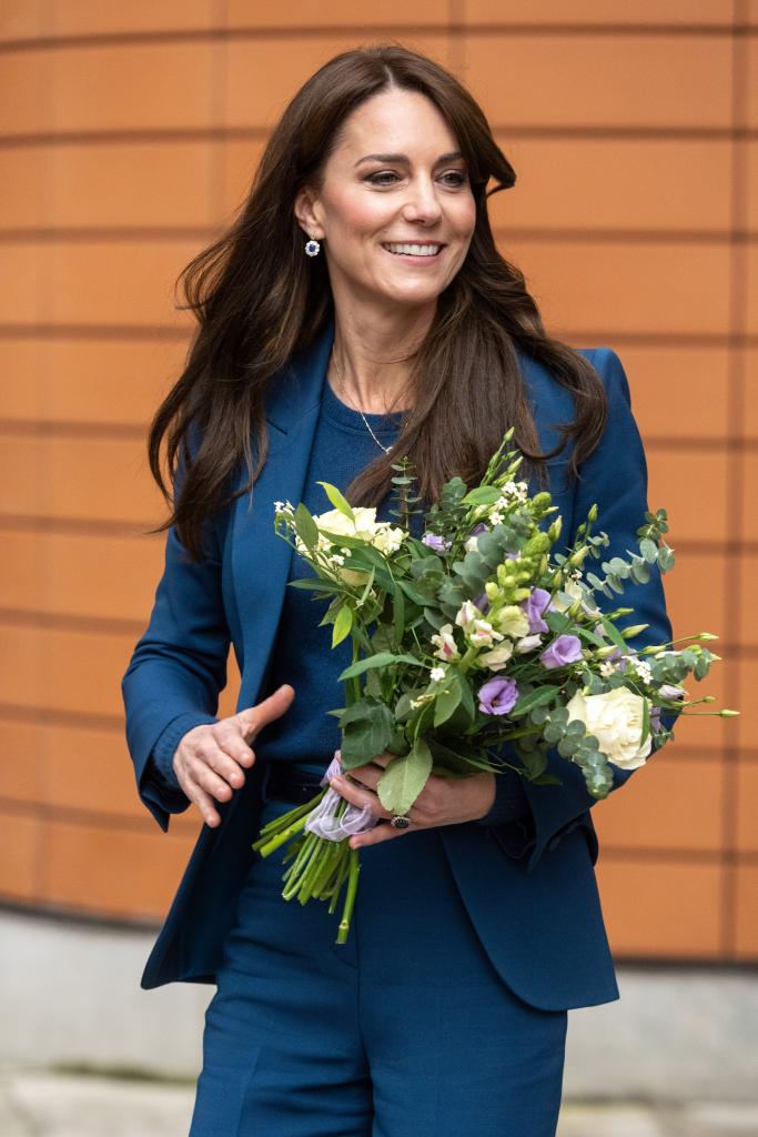 Kate Middleton holding flowers.