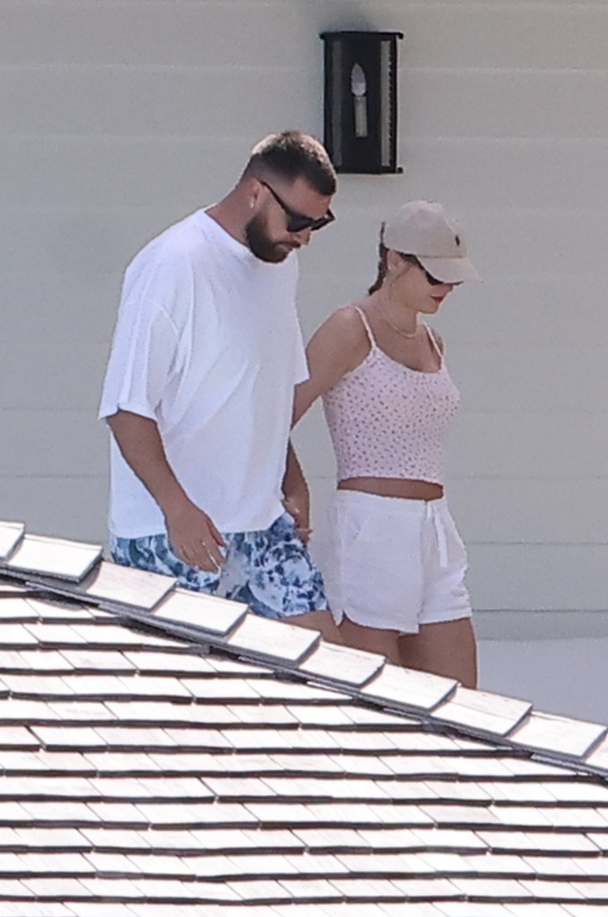 Travis Kelce and Taylor Swift holding hands in the Bahamas. 