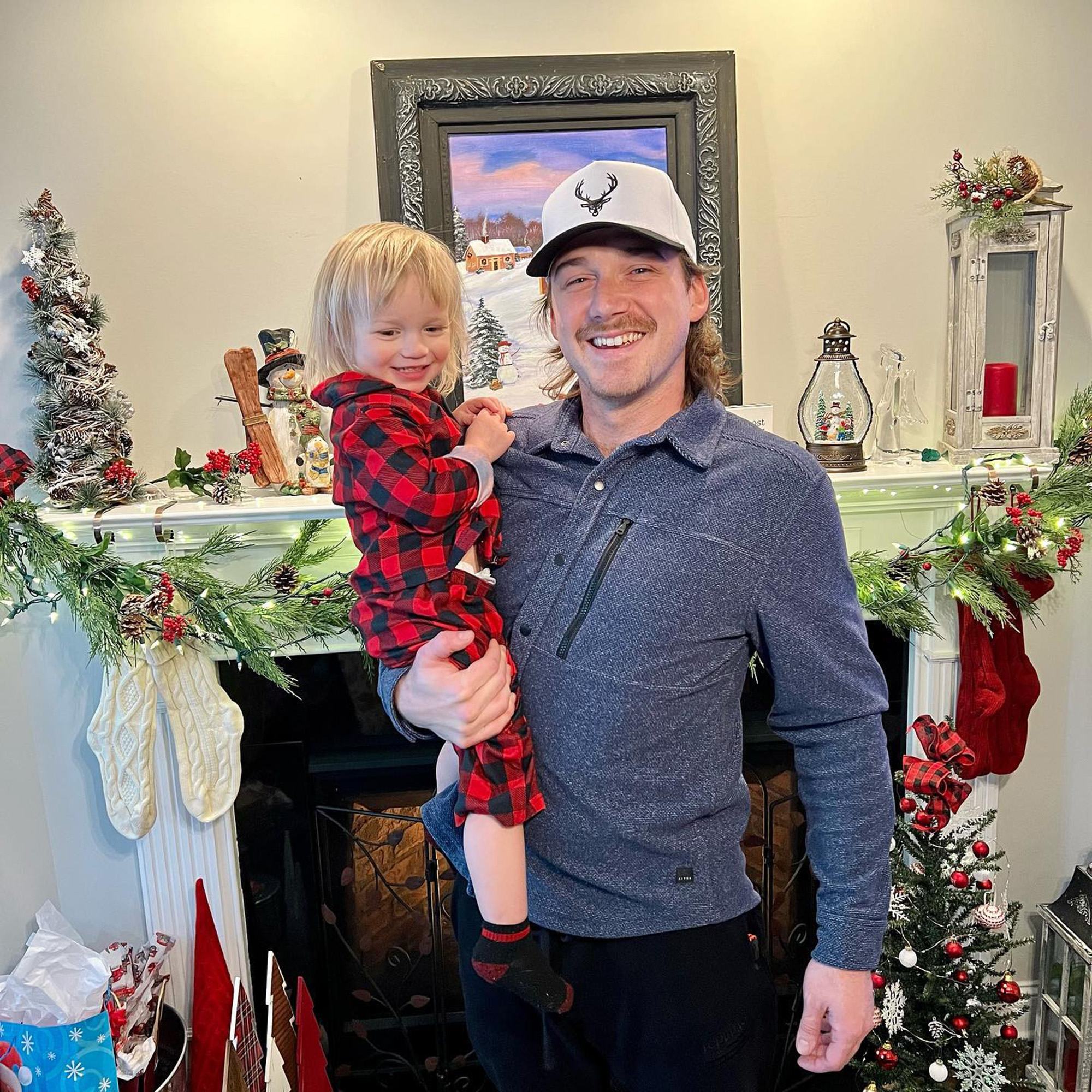 Morgan Wallen carrying his son.