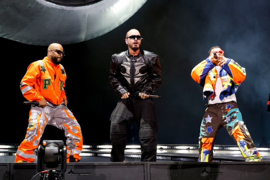 J Balvin (C) performs with Randy Ortiz Acevedo (L) and Joel Muñoz Martíne (R) of Jowell & Randy at the Coachella Stage during the 2024 Coachella Valley Music and Arts Festival at Empire Polo Club on April 21, 2024