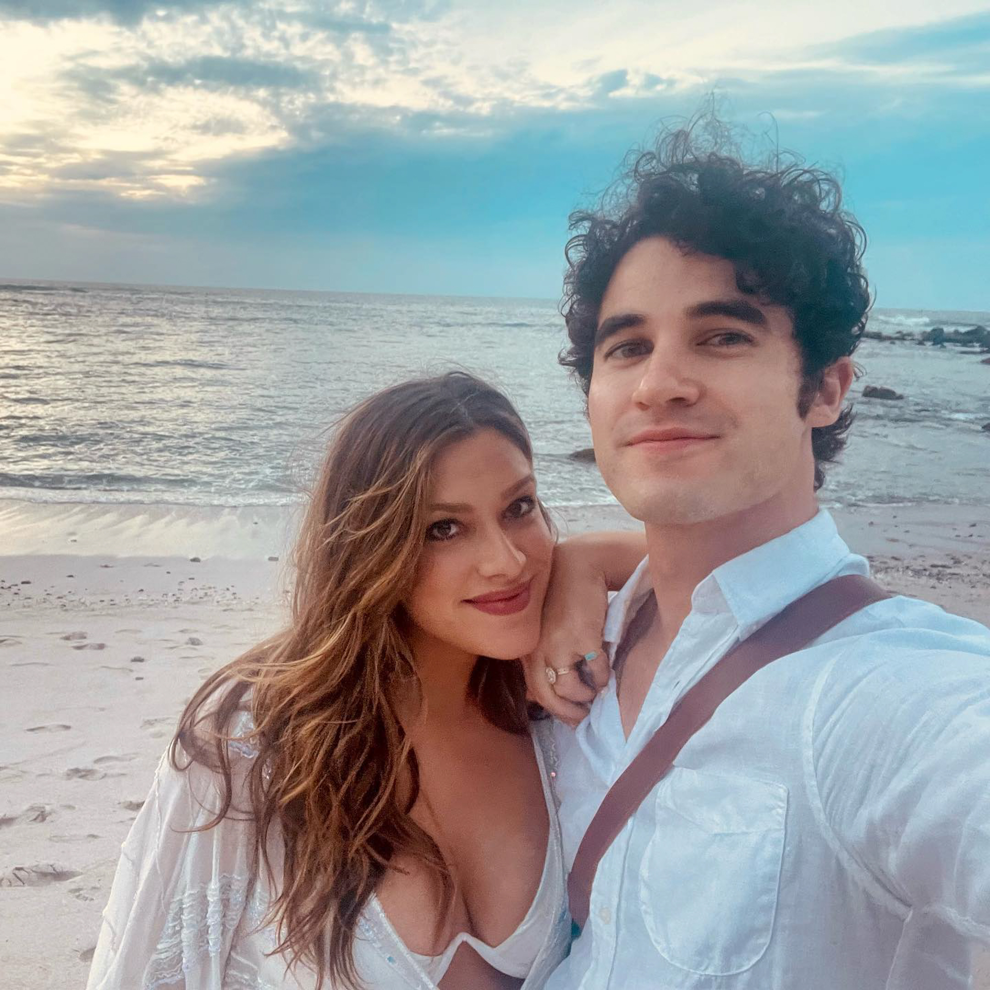 Darren Criss and Mia Swier on the beach.