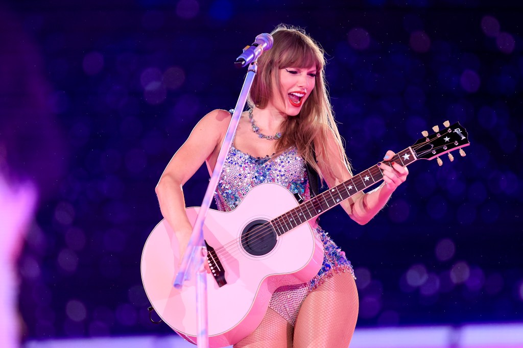 Taylor Swift performing on stage. 