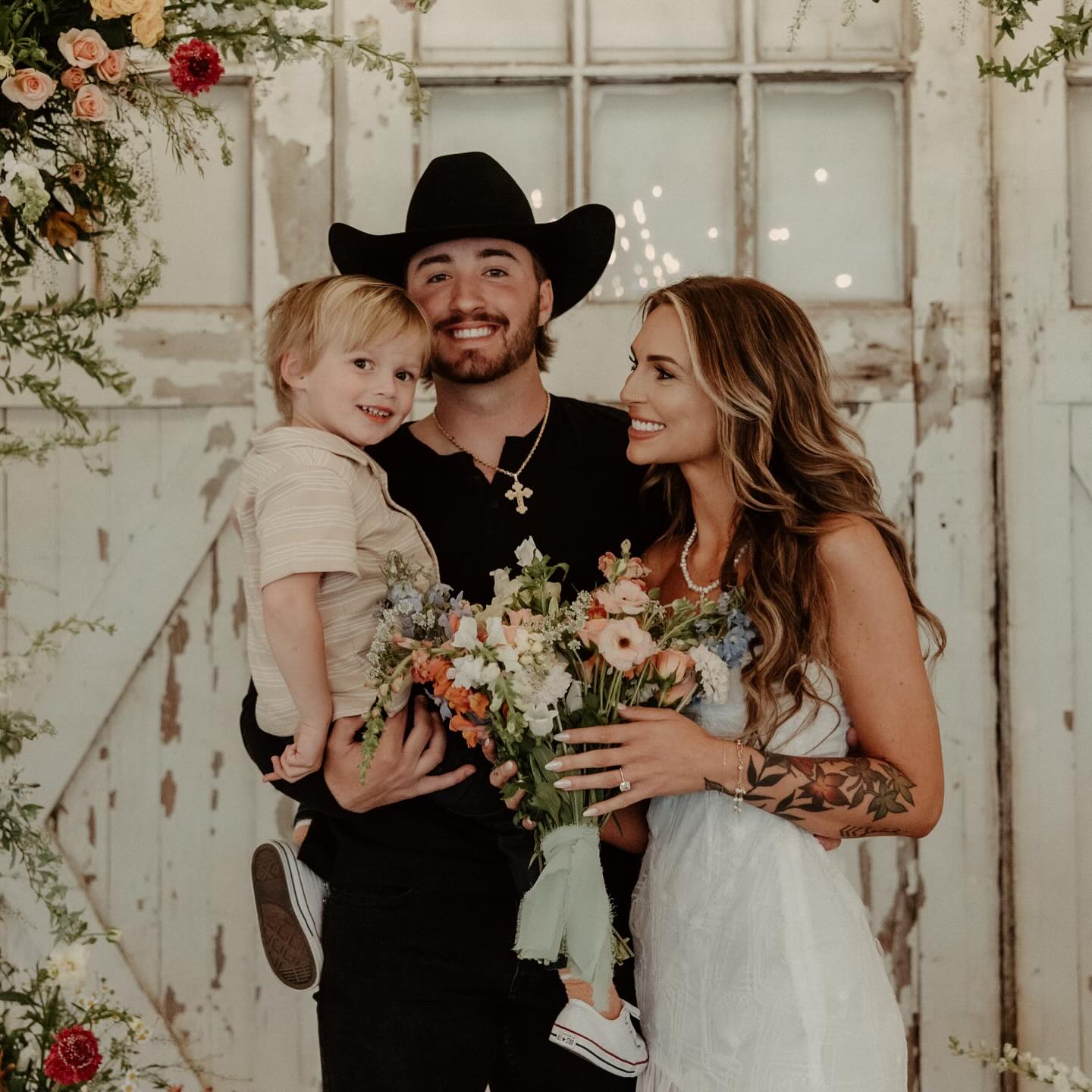 KT Smith on her wedding day with her son and husband.