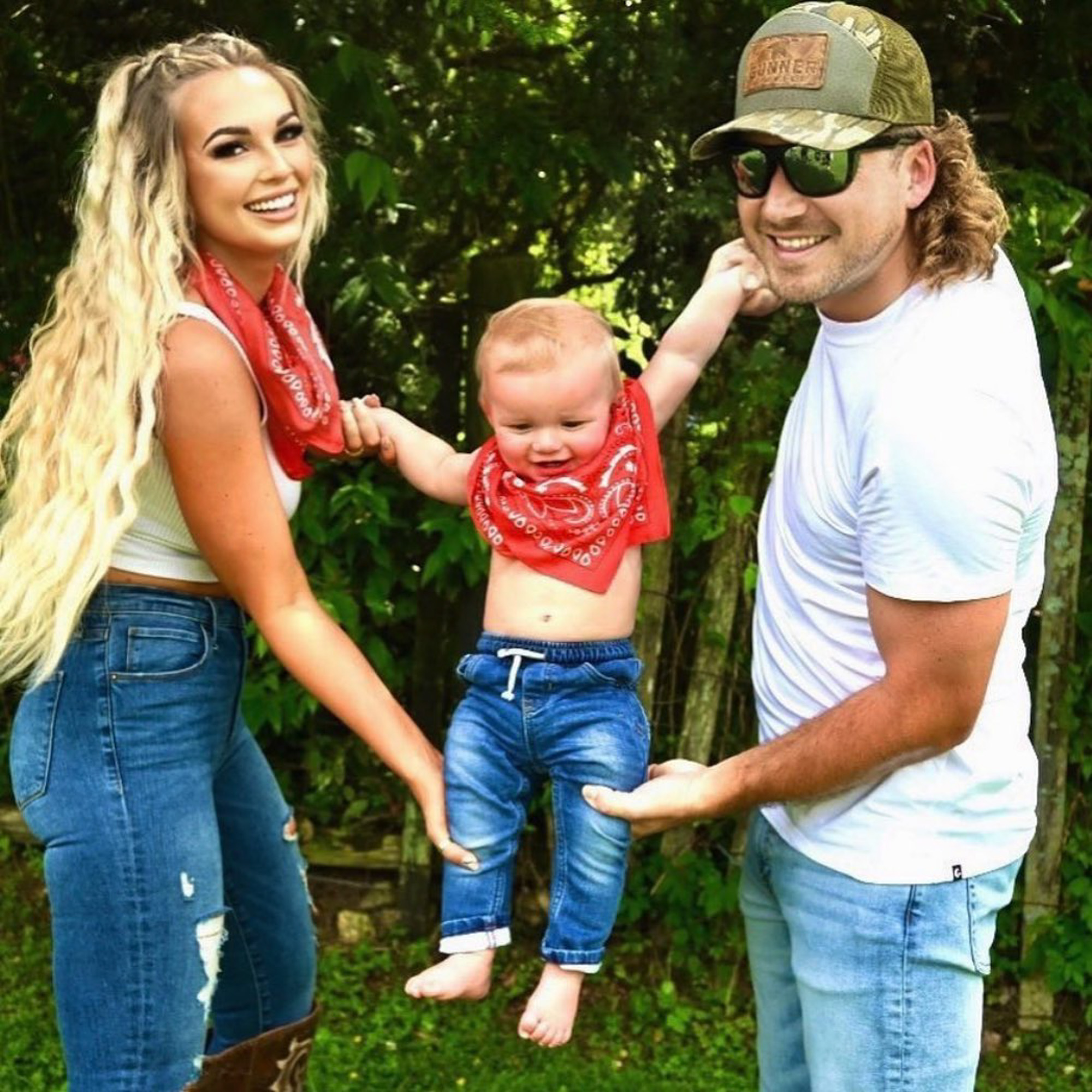 KT Smith and Morgan Wallen playing with their son.