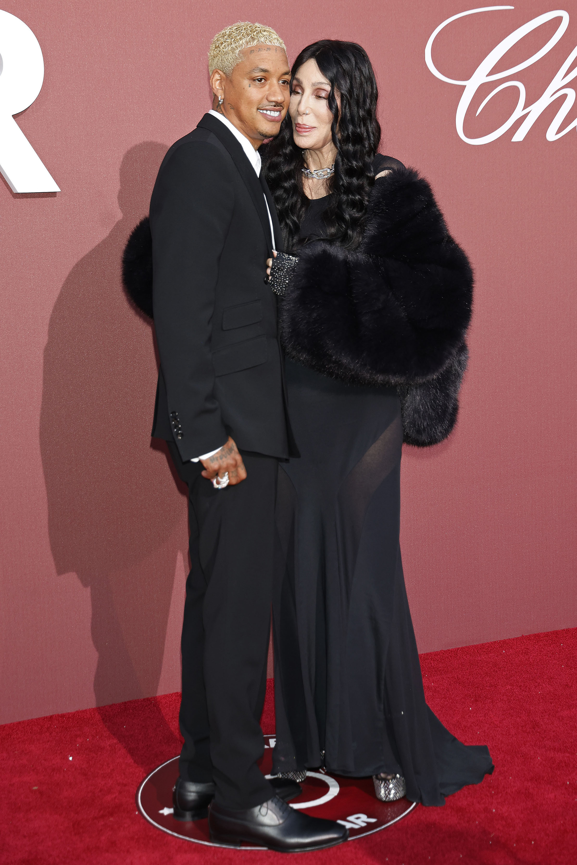 Alexander Edwards and Cher at the 2024 amfAR Cinema Against AIDS Gala.