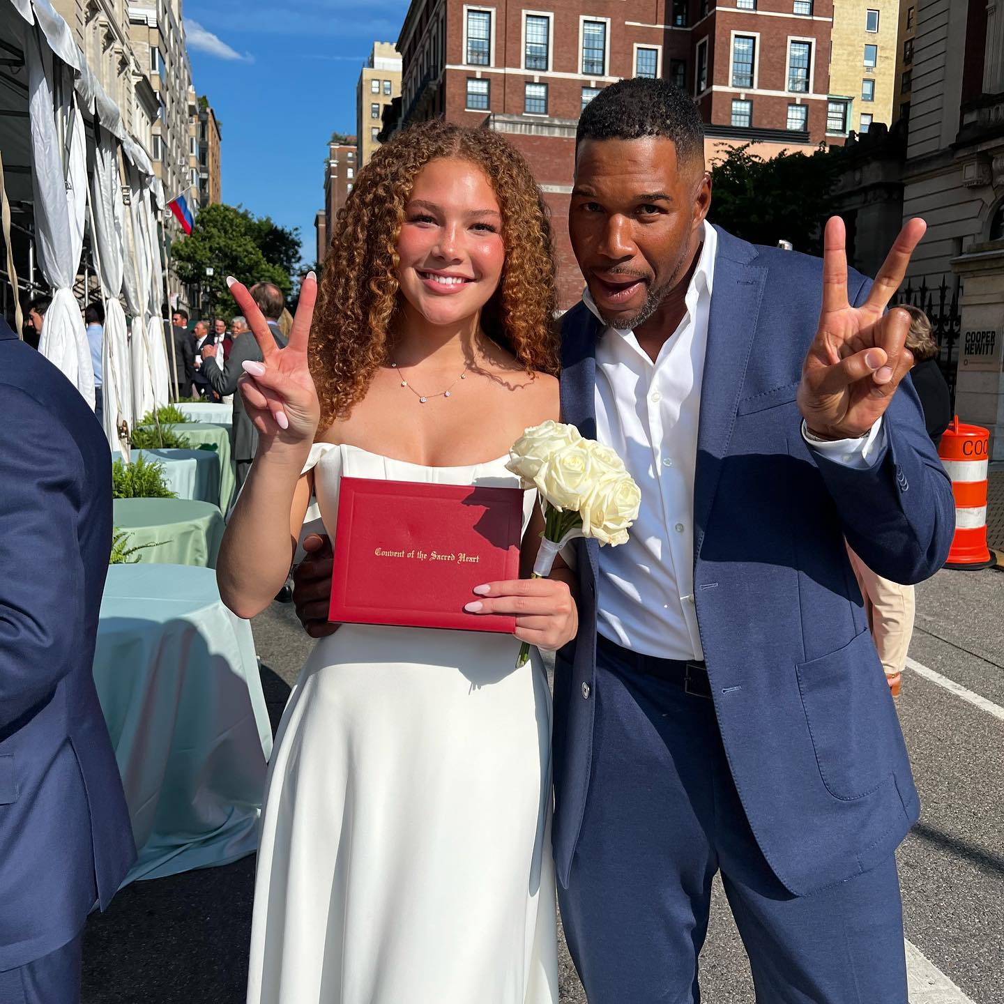 Michael Strahan and Isabella at her graduation.