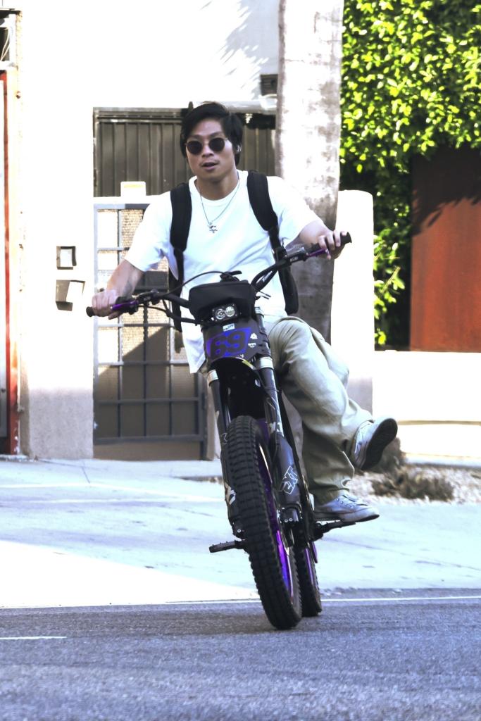 pax jolie-pitt rides an e-bike