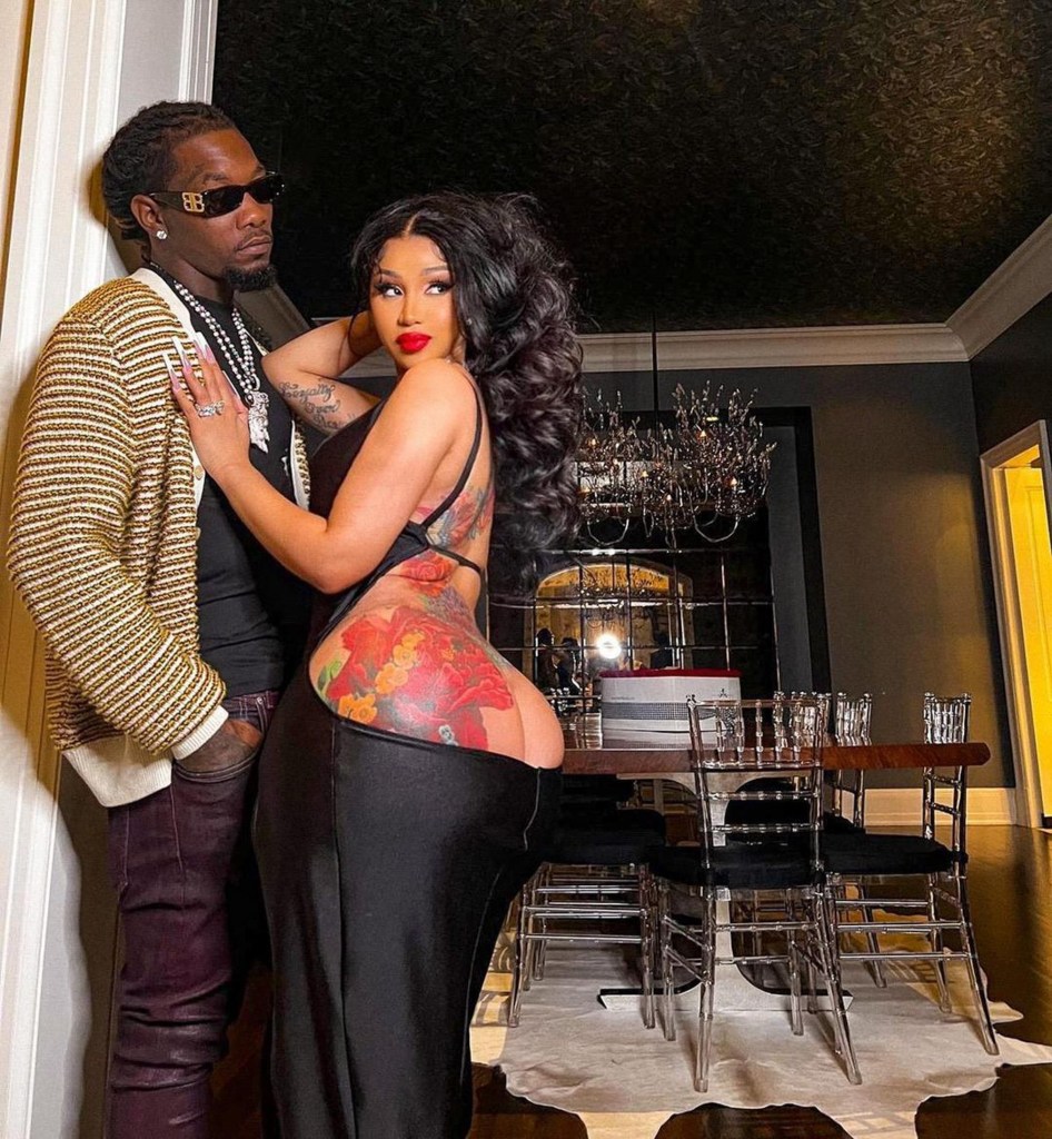 Offset and Cardi B posing for a photo together. 