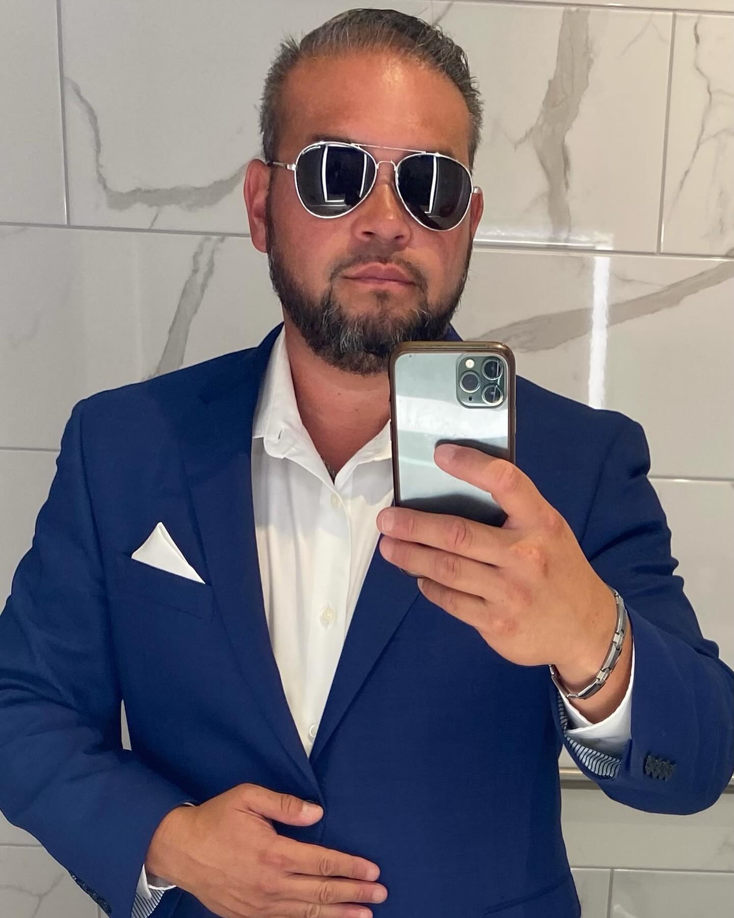 jon gosselin mirror selfie in a suit and sunglasses