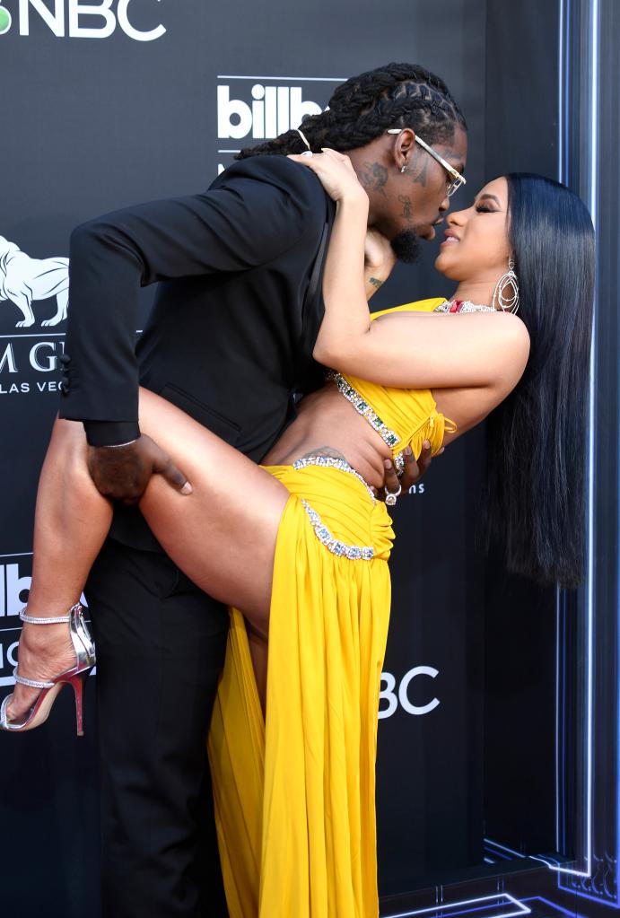 Cardi B and Offset on a red carpet in 2019. 