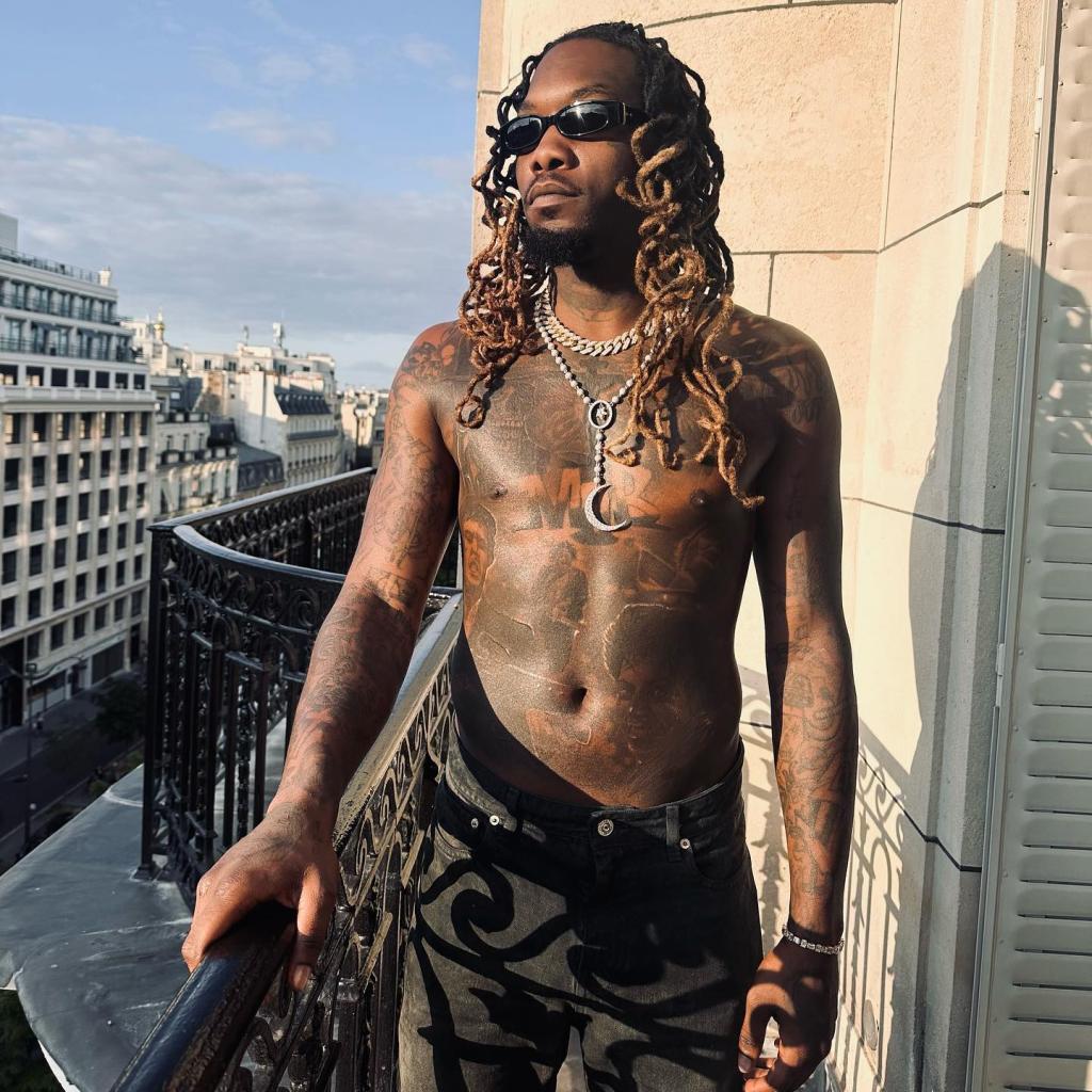 Offset shirtless on a balcony. 