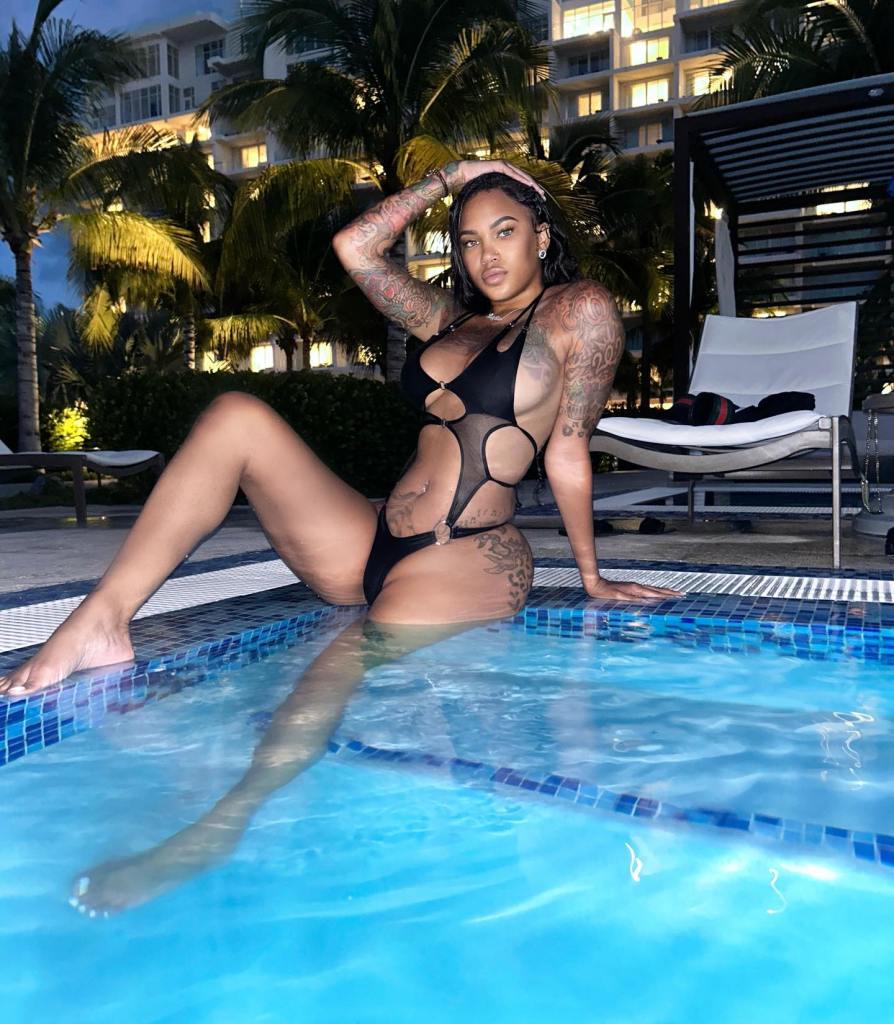 Big PrettyRedz posing in a pool. 