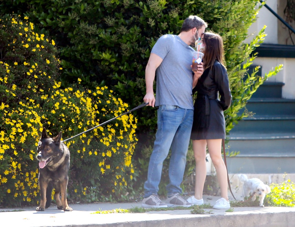 Ana de Armas and Ben Affleck look close during dog walk.