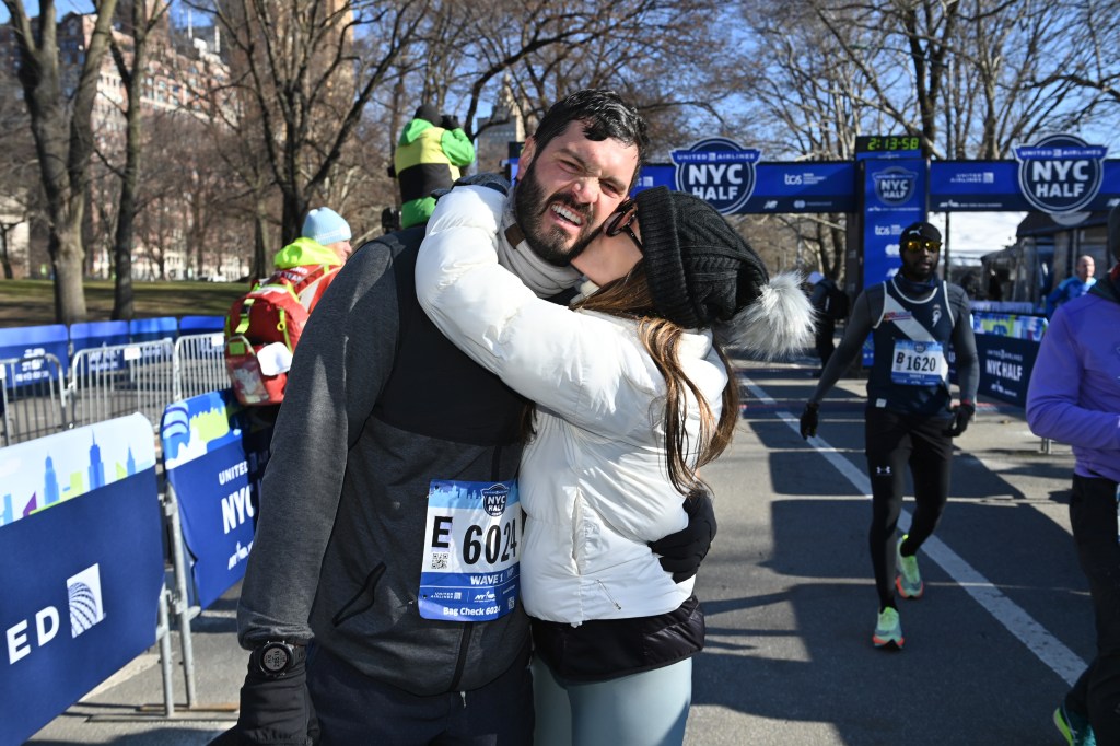 Andi Dorfman kisses Blaine Hart during March 2023 half marathon in New York City