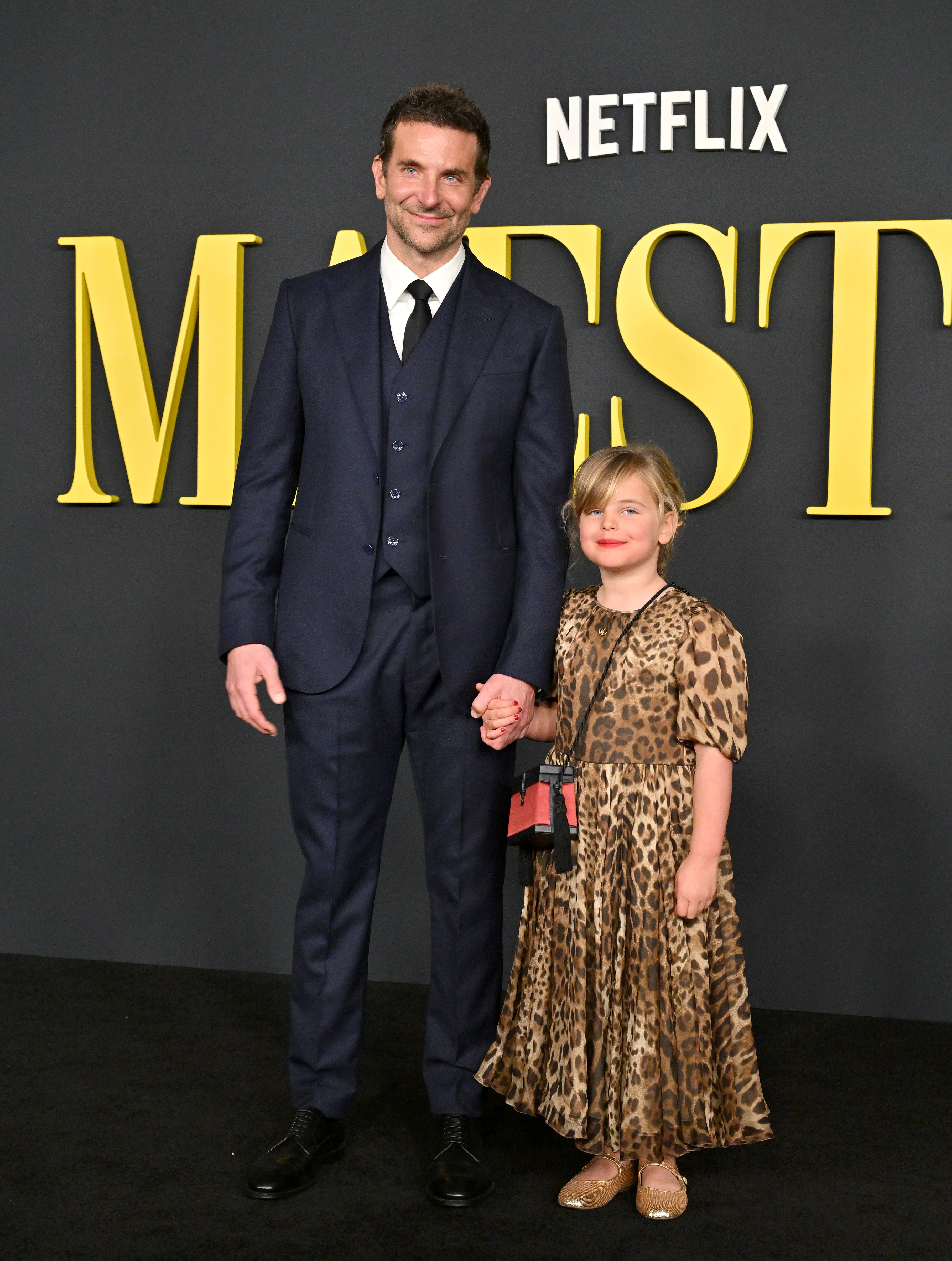 Bradley Cooper and Lea posing on a red carpet