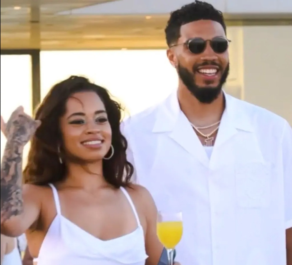 Ella Mai and Jayson Tatum at an all-white party.