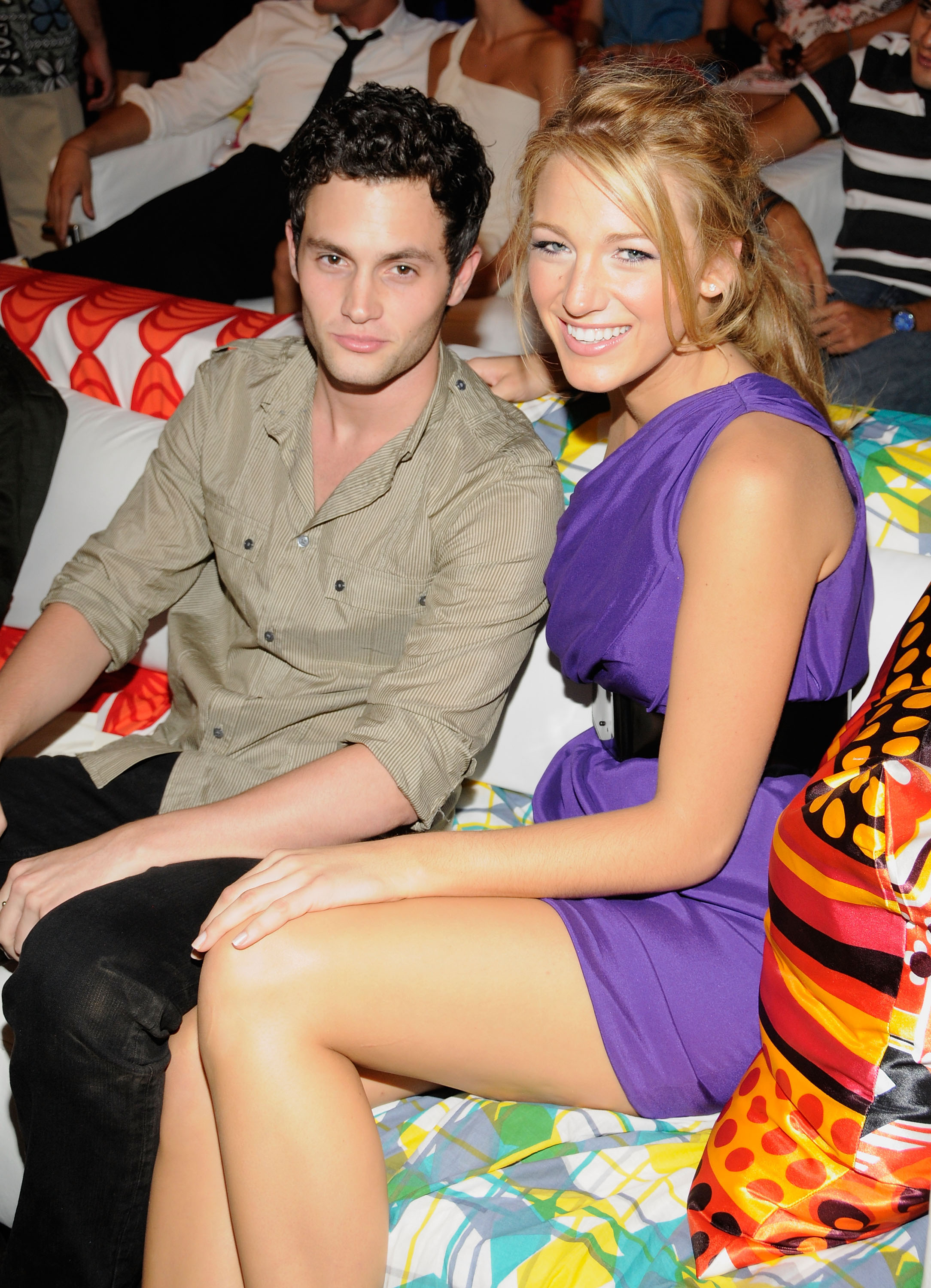 Penn Badgley and Blake Lively sitting on a couch together in 2008