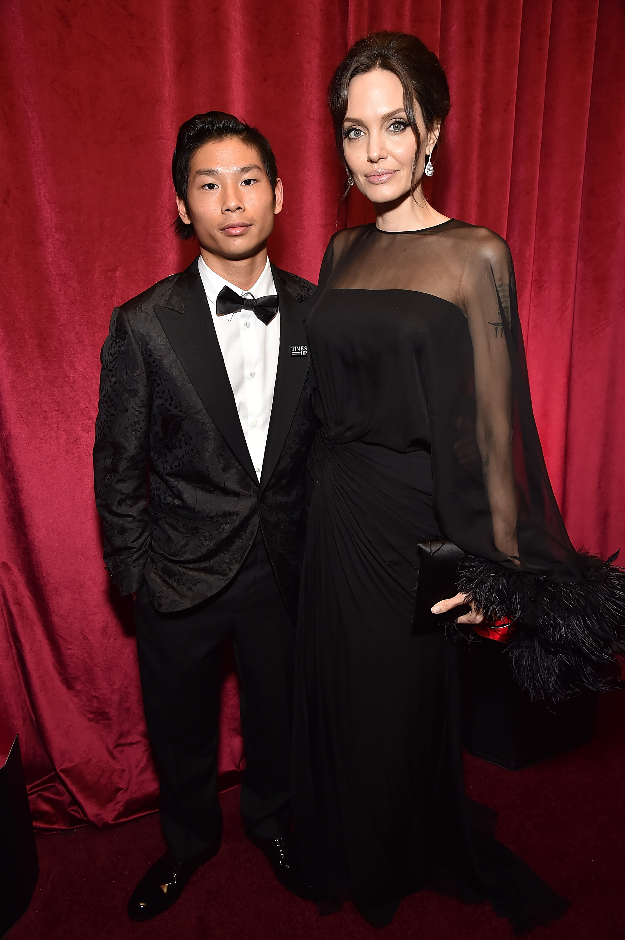 angelina jolie and pax jolie-pitt in black-tie outfits