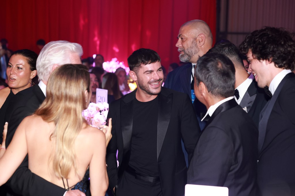 Zac Efron at the amfAR Gala in Venice on Sept. 1, 2024 with Richard Gere and Alejandra Silva. 