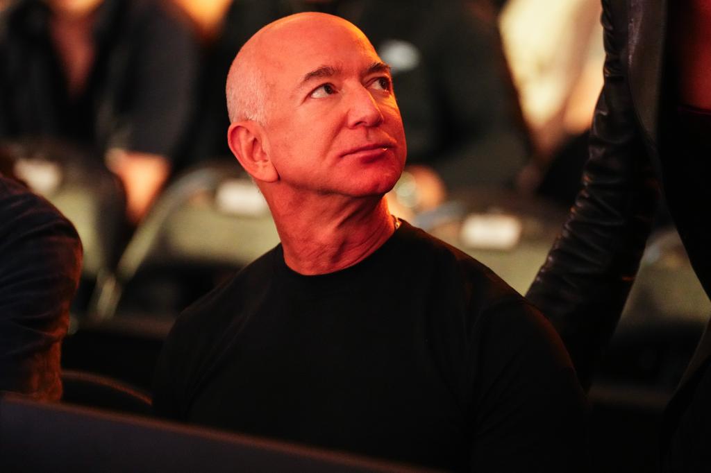 Sanchez and Bezos sat cageside at the event.