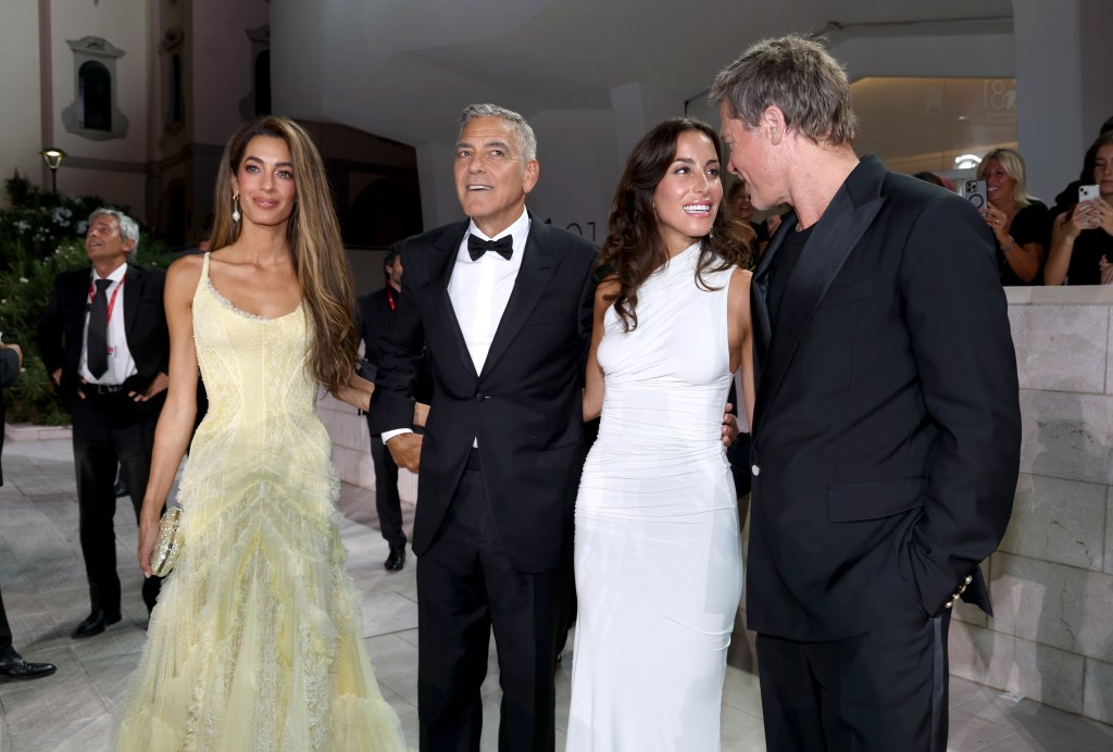 Amal Clooney, George Clooney, Ines de Ramon and Brad Pitt attend the "Wolfs" red carpet during the 81st Venice International Film Festival on September 01, 2024 in Venice, Italy. 