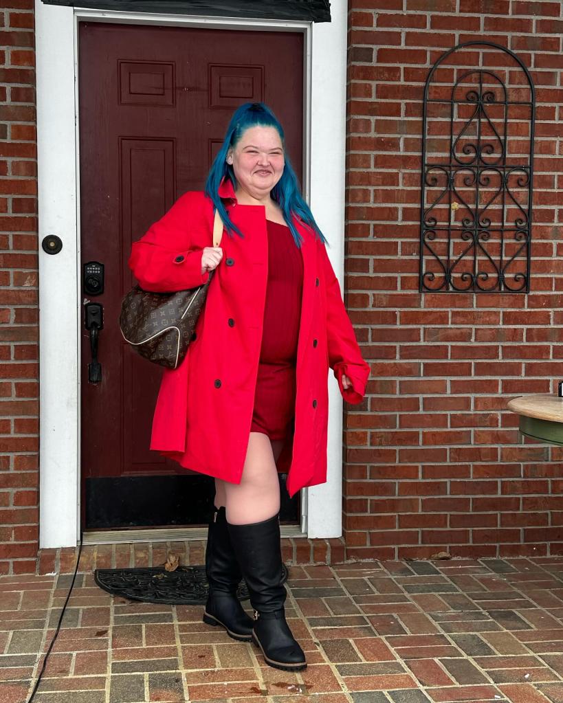 Amy Slaton posing in a red jacket.