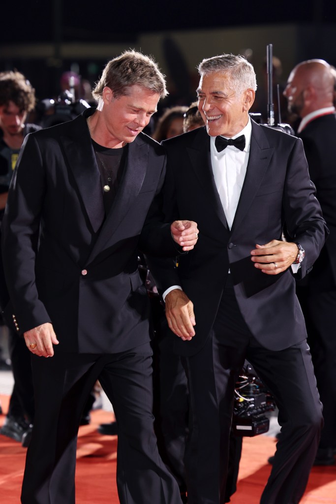 Brad Pitt and George Clooney attend the "Wolfs" red carpet during the 81st Venice International Film Festival on September 01, 2024 in Venice, Italy.