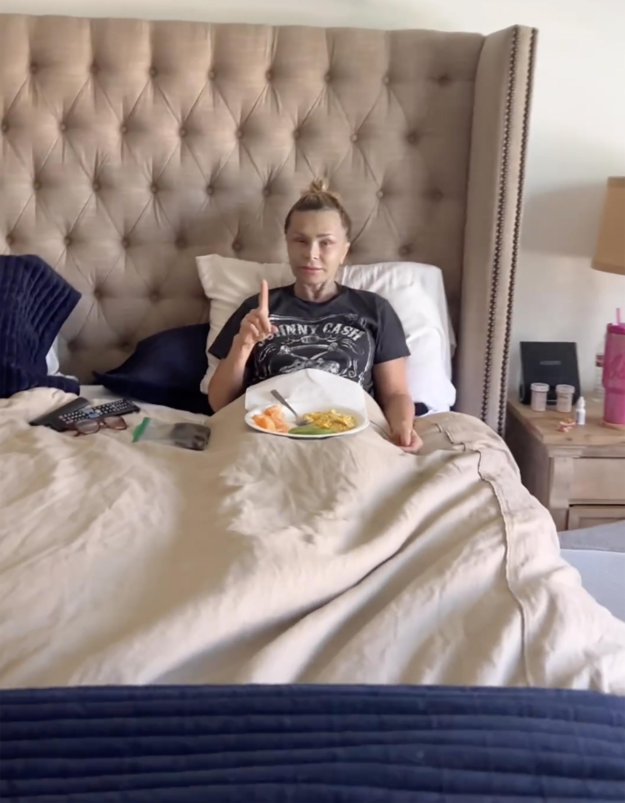 Tamra Judge sitting in bed after her plastic surgery 