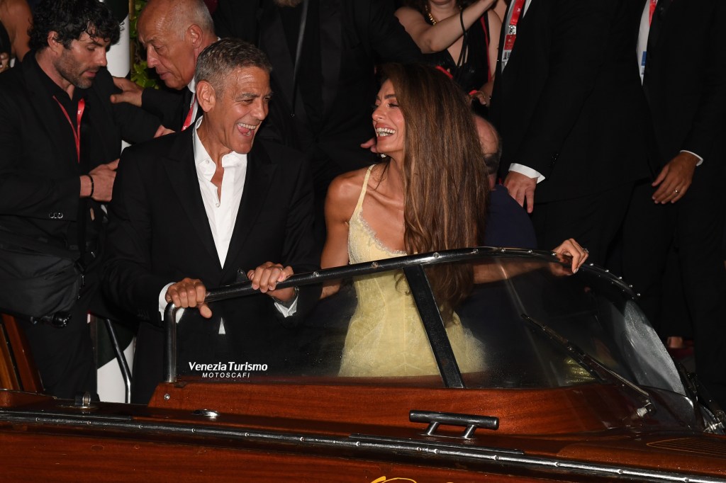 Amal and George Clooney leaving their hotel in Venice, Italy.