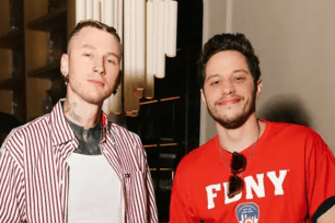 Machine Gun Kelly in a red striped shirt with Pete Davidson in a red FDNY shirt.