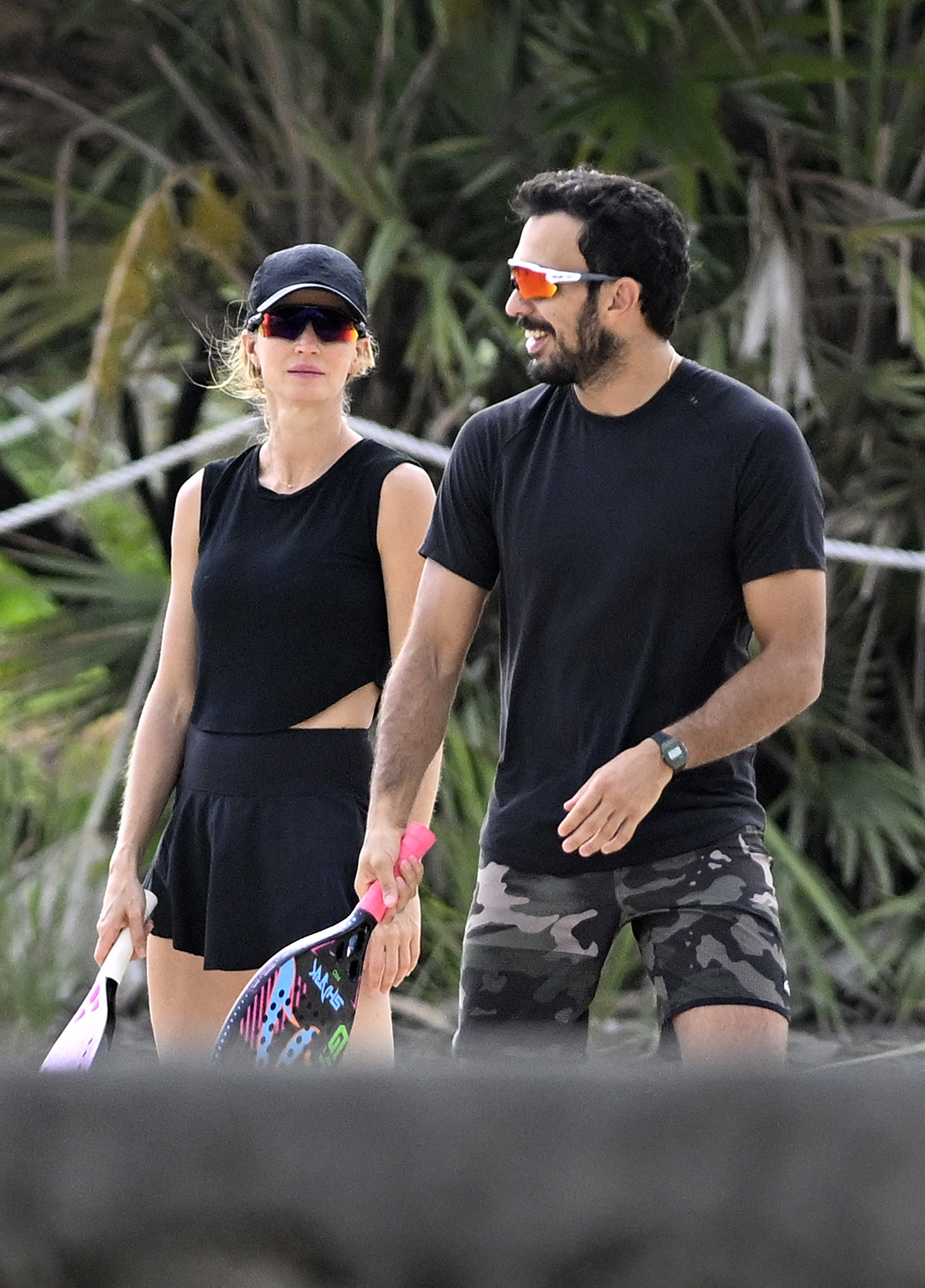 Gisele Bündchen and Joaquim Valente playing beach tennis in August 2024.