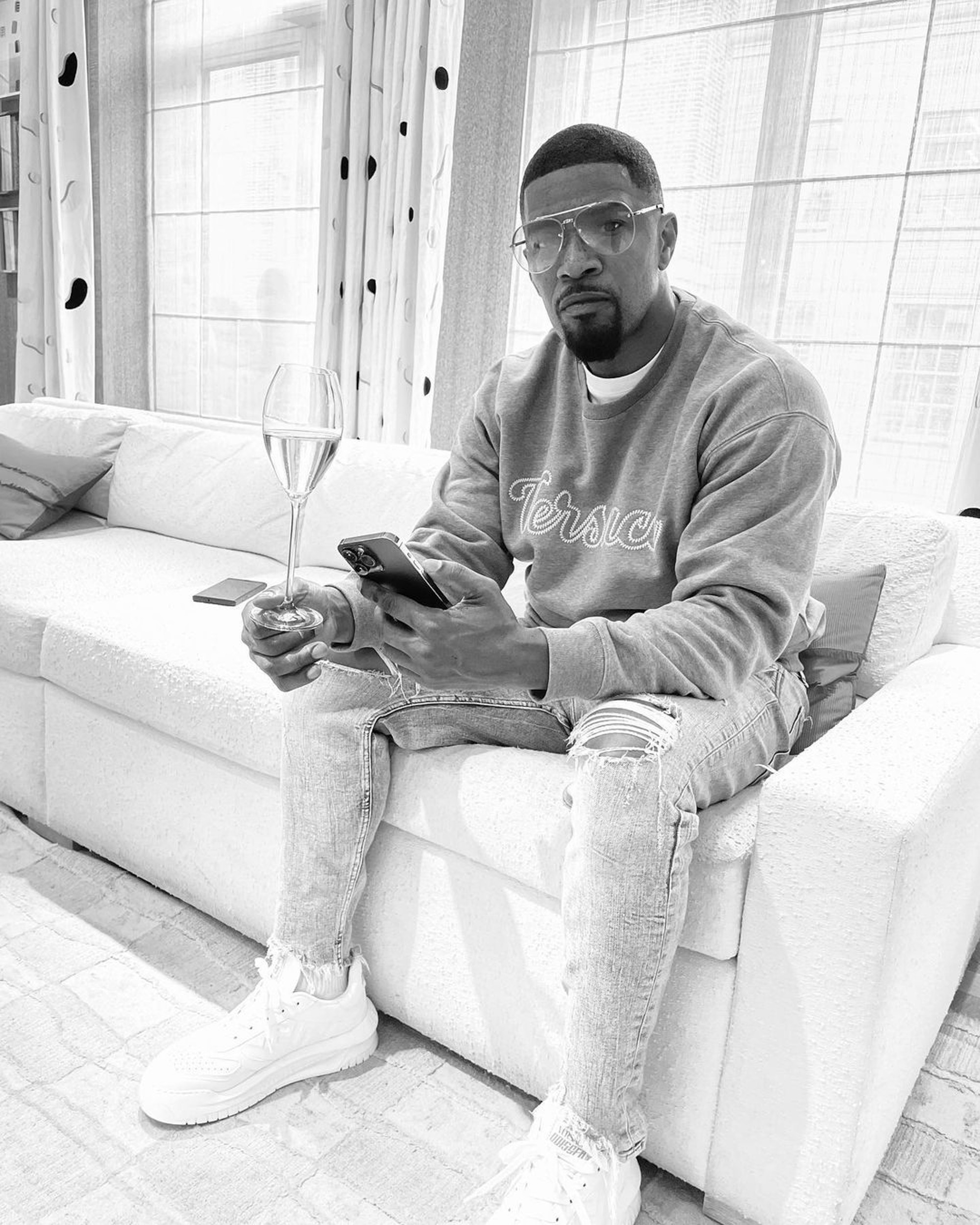 Jamie Foxx sitting on a couch