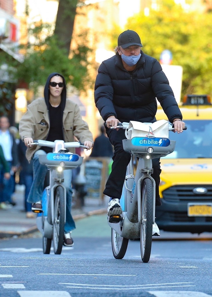 Leonardo DiCaprio and girlfriend Vittoria Ceretti  biking in New York City on Oct. 12. 