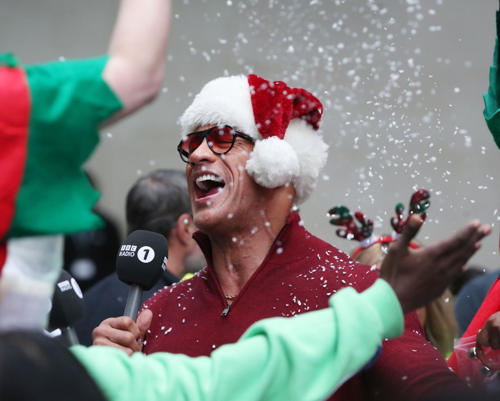 Dwayne "The Rock" Johnson gets into the holiday spirit during an interview at BBC Broadcasting House in London.