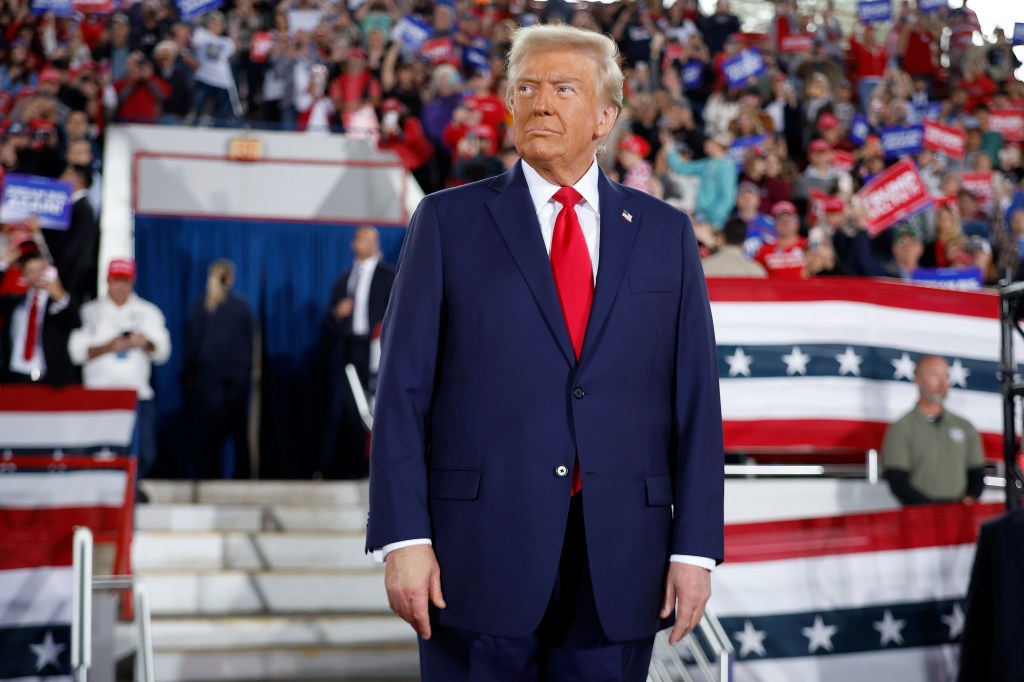 Former U.S. President Donald Trump takes the stage during a campaign rally at the J.S. Dorton Arena on November 04, 2024 in Raleigh, North Carolina. 