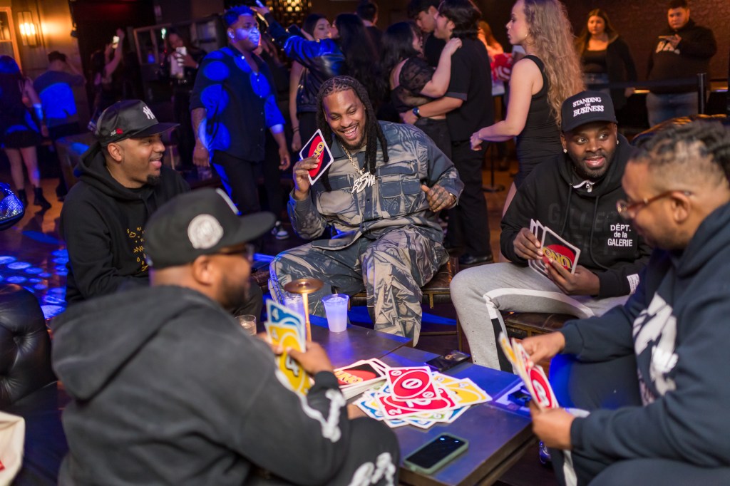 Waka Flocka Flame plays a game of Giant Uno with friends at Slate in NYC before surprising the crowd with a performance.