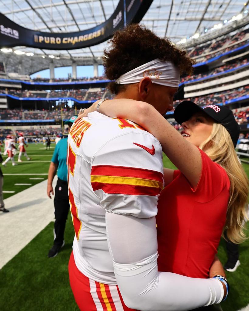 Brittany Mahomes and Patrick Mahomes pack on the PDA at a Chiefs game on Sept. 29.